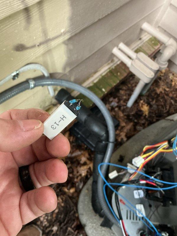 Replaced defective top capacitor on outdoor HVAC unit. Disconnected and removed failed capacitor, installed new 75W43 capacitor, reconnected all electrical terminals, and verified proper system operation upon completion.