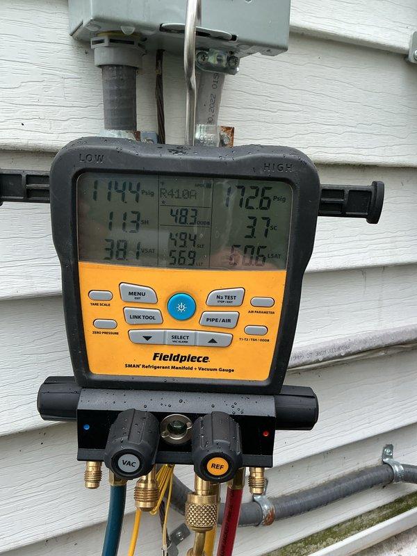 Completed scheduled air conditioning maintenance on residential split system. Performed refrigerant pressure and temperature analysis using digital manifold gauges, recording operating pressures of 114 PSI on low side and 173 PSI on high side with corresponding temperatures. Unit operating within normal parameters on outdoor condenser pad.