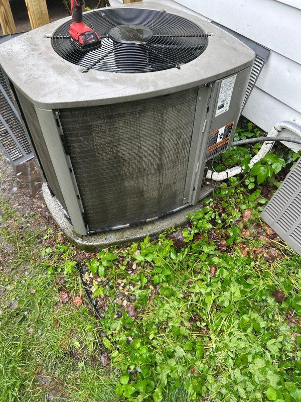Completed annual cooling maintenance on residential outdoor condensing unit. Performed comprehensive system inspection including electrical testing with multimeter to verify proper voltage and amperage readings. Cleaned condenser coils and fins which showed significant dirt and debris accumulation affecting heat transfer efficiency. Checked refrigerant levels and system pressures. Inspected fan motor operation and blade condition. Verified proper drainage and cleared vegetation growth from around unit perimeter to ensure adequate airflow clearance. Replaced air filter and evaporator pad as scheduled. Confirmed all safety controls functioning properly and unit operating within manufacturer specifications.