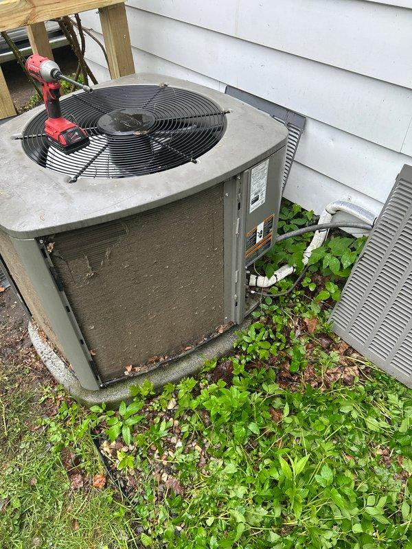 Completed annual cooling maintenance on residential outdoor condensing unit. Performed comprehensive system inspection including electrical testing with multimeter to verify proper voltage and amperage readings. Cleaned condenser coils and fins which showed significant dirt and debris accumulation affecting heat transfer efficiency. Checked refrigerant levels and system pressures. Inspected fan motor operation and blade condition. Verified proper drainage and cleared vegetation growth from around unit perimeter to ensure adequate airflow clearance. Replaced air filter and evaporator pad as scheduled. Confirmed all safety controls functioning properly and unit operating within manufacturer specifications.