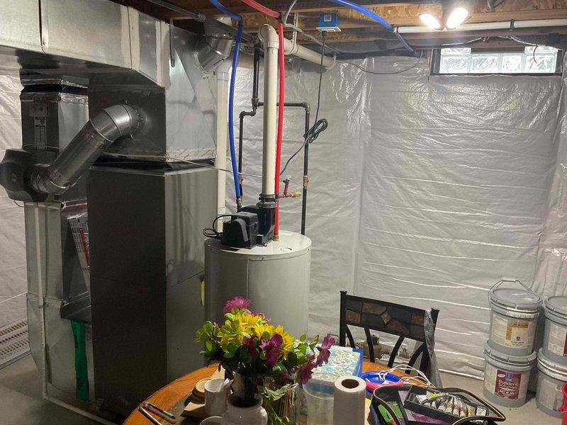 Completed assessment for water heater replacement in basement mechanical room. Existing 11-year-old water heater is non-operational and requires full replacement. Evaluated installation area containing natural gas furnace with adjacent water heater, noting existing PEX plumbing connections (hot and cold supply lines), gas line access, and proper venting requirements. Documented current equipment configuration including connection points, clearance specifications, and mechanical room layout. Provided comprehensive estimate for new water heater installation including removal and disposal of failed unit, installation of replacement water heater with code-compliant connections, pressure relief valve, expansion tank if required, and all necessary supply line modifications to ensure proper integration with existing plumbing system.