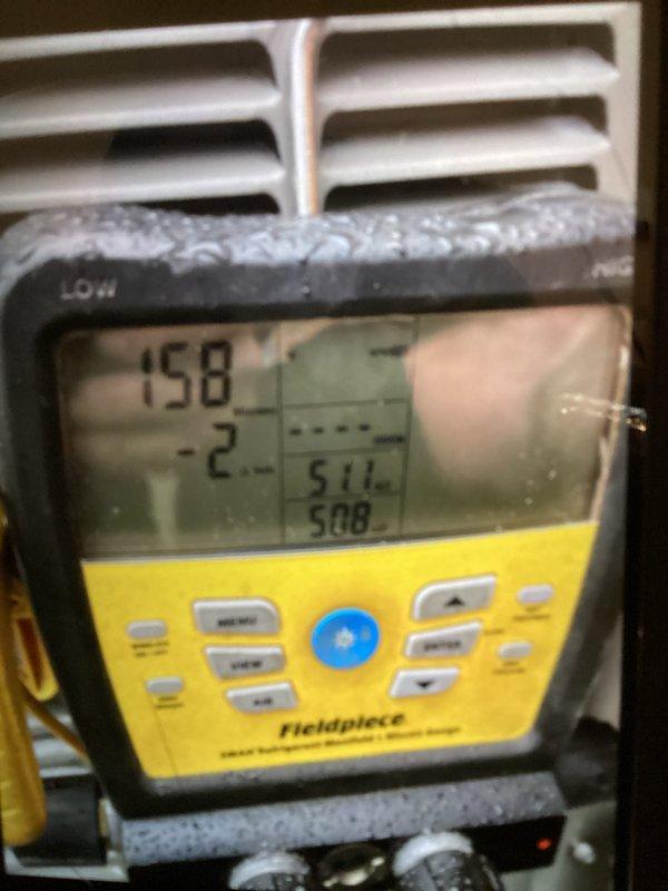 Completed installation of 2-ton air conditioning system with evaporator coil in basement mechanical room. Unit positioned with rear discharge configuration, copper refrigerant lines properly connected and insulated, system reconnected to existing electrical service. System tested and verified operational with proper refrigerant pressures and airflow measurements confirmed using diagnostic equipment.