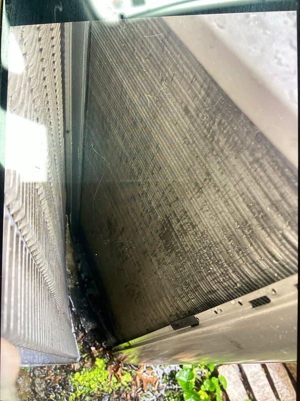 Completed annual preventative maintenance on residential cooling system. Evaporator coil showed heavy accumulation of dust and debris throughout heat exchange surfaces, with biological growth present in drain pan area. Thoroughly cleaned and inspected all components per manufacturer specifications to restore system efficiency and proper operation.