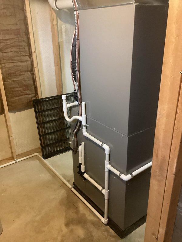 Completed full HVAC system installation including 110,000 BTU gas furnace with integrated humidifier and 4-ton air conditioning unit with right-side configuration. Installed all necessary PVC condensate drainage piping, refrigerant line set, electrical connections, and supply/return ductwork transitions in basement mechanical room. Secured mechanical and electrical permits, reconnected all utilities, tested system operation for proper heating and cooling function, and ensured all components met manufacturer specifications and local code requirements.
