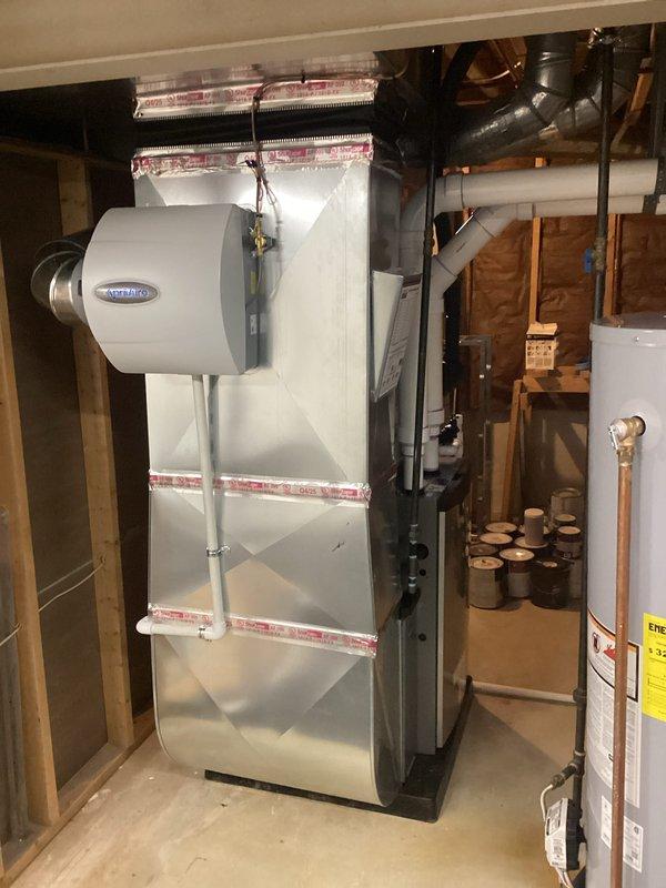 Completed full HVAC system installation including 110,000 BTU gas furnace with integrated humidifier and 4-ton air conditioning unit with right-side configuration. Installed all necessary PVC condensate drainage piping, refrigerant line set, electrical connections, and supply/return ductwork transitions in basement mechanical room. Secured mechanical and electrical permits, reconnected all utilities, tested system operation for proper heating and cooling function, and ensured all components met manufacturer specifications and local code requirements.
