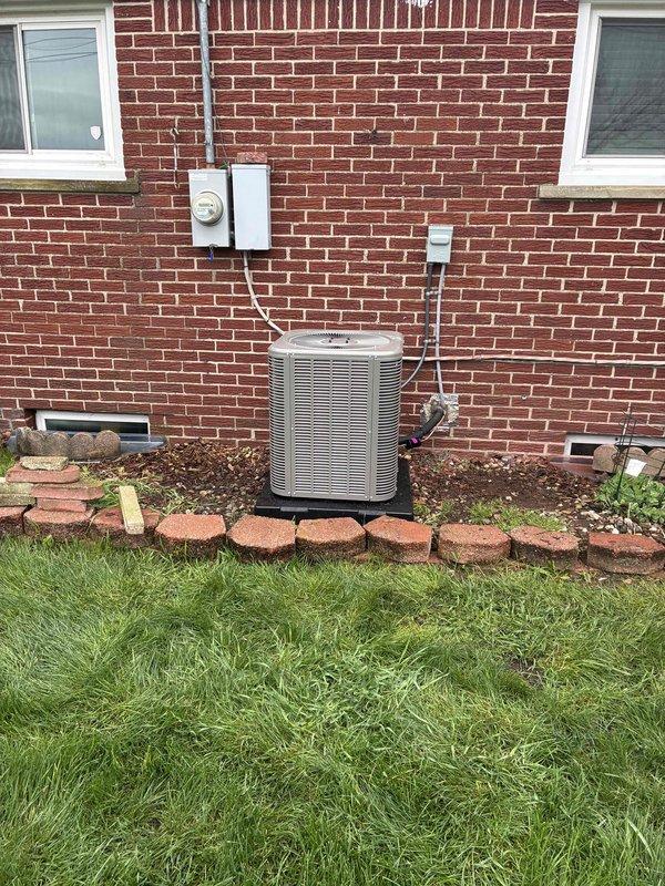 Completed full HVAC system installation including a 70,000 BTU furnace with humidifier and 2-ton air conditioning unit. Installed new furnace in basement utility area with proper venting and ductwork connections, secured refrigerant lines, and integrated humidification system. Positioned exterior condenser unit on rear pad with proper clearances, ran refrigerant lines and electrical conduit up exterior brick wall to disconnect box, completed all electrical connections, and reconnected system components. Mechanical permit obtained prior to installation, all equipment tested and operational upon completion.