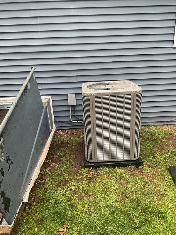 Completed full HVAC system installation including a 70,000 BTU furnace and 2-ton air conditioning unit with right-side placement. Installed new air handler in basement utility space with associated PVC condensate drainage system, insulated refrigerant lines, and electrical conduit connections. Positioned outdoor condensing unit on pad adjacent to building exterior with proper service clearances and reconnected all refrigerant lines and electrical service. Obtained mechanical and electrical permits prior to installation. Configured complete ductwork integration including plenum transitions and verified all system connections. Submitted completion certificate documentation and finalized all required paperwork for energy efficiency program compliance.