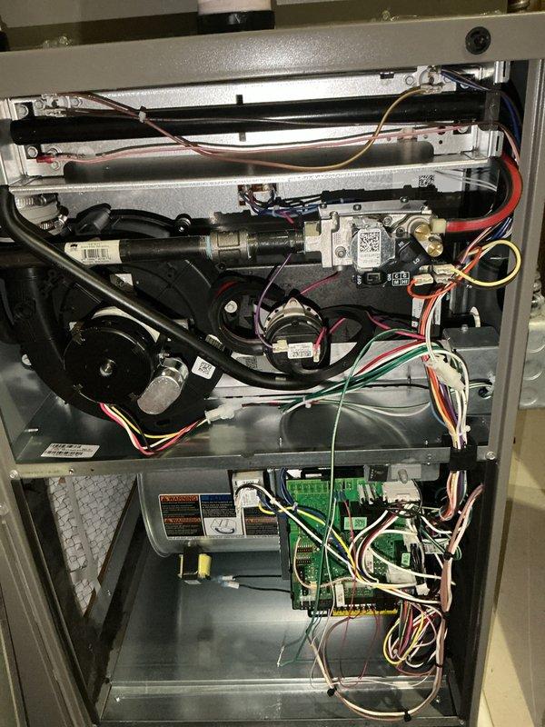 Completed comprehensive Air Care Heating and Cooling recurring maintenance service on residential HVAC system. Performed full system inspection with access panel removal, documenting all internal components including blower motor assembly, gas valve controls, heat exchanger, circuit control boards, electrical connections, and safety systems. All components photographed and verified to be in proper working condition with no issues identified during this scheduled maintenance visit.