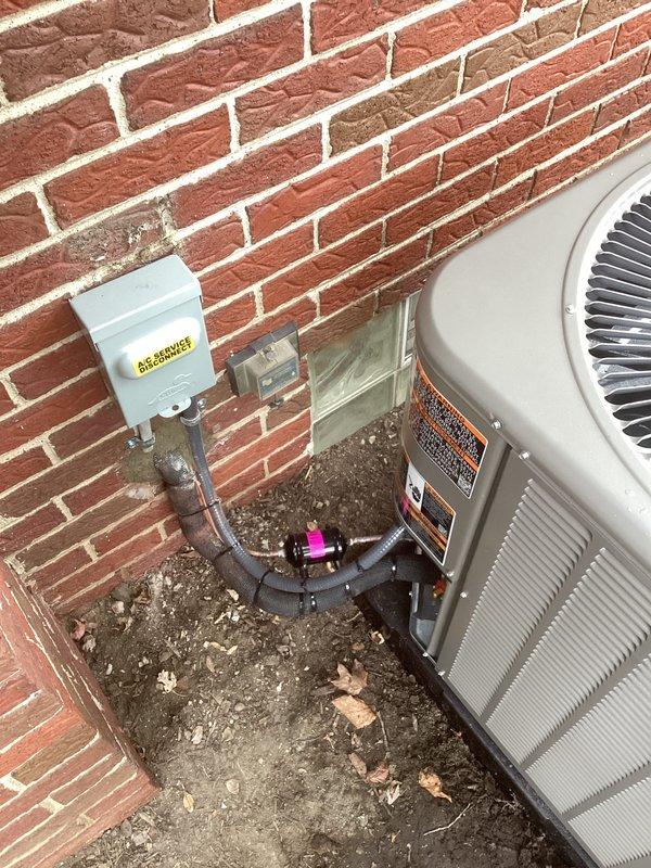 Completed full HVAC system installation including a 70,000 BTU gas furnace with humidifier and 2.5-ton air conditioning unit with right-side configuration. Obtained mechanical and electrical permits prior to installation. Installed outdoor condenser unit on concrete pad against brick exterior wall with proper electrical disconnect box and refrigerant line connections. Routed PVC condensate drain and exhaust venting through exterior wall with appropriate termination fittings. Reconnected all electrical service, verified proper refrigerant charge, and tested system operation to ensure heating and cooling functionality.