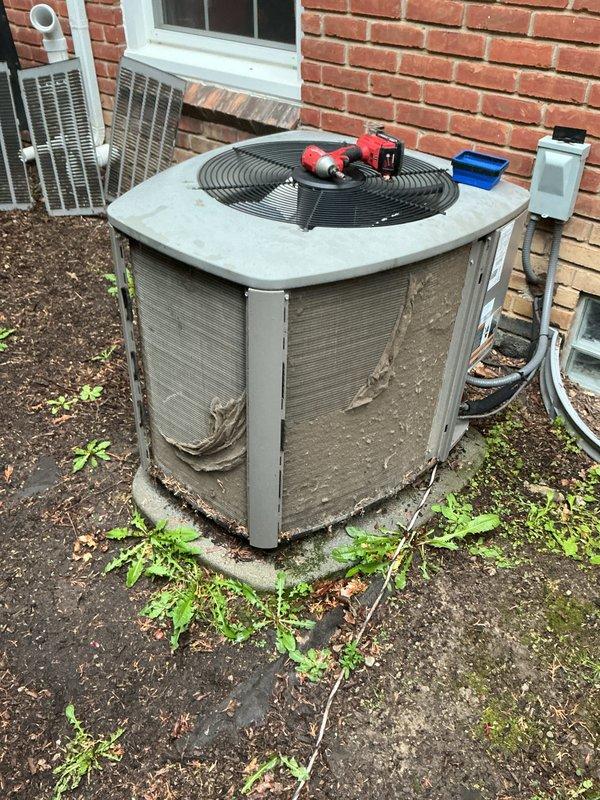 Completed annual cooling maintenance on residential air conditioning system. Performed comprehensive inspection of outdoor condenser unit, checked refrigerant pressures using manifold gauges, and identified need for air filter replacement. Unit operational at time of service with all components functioning within normal parameters.