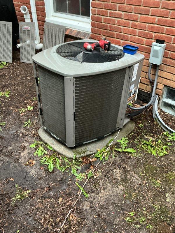 Completed annual cooling maintenance on residential air conditioning system. Performed comprehensive inspection of outdoor condenser unit, checked refrigerant pressures using manifold gauges, and identified need for air filter replacement. Unit operational at time of service with all components functioning within normal parameters.