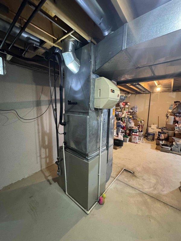 Conducted on-site evaluation of existing 26-year-old residential HVAC system located in basement for complete air conditioning and furnace replacement estimate. Assessed current equipment condition, ductwork configuration, electrical requirements, and available installation space to provide comprehensive system replacement options with warranty and guarantee information for customer comparison purposes.