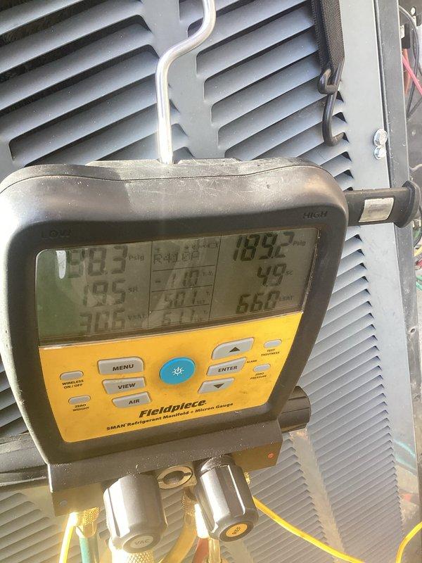Completed comprehensive tune-up on 13-year-old residential air conditioning system. Performed full system diagnostics using refrigerant manifold gauges to verify operating pressures and temperatures, inspected condensing unit exterior components, and confirmed proper system performance. All measurements recorded within acceptable parameters for continued operation.