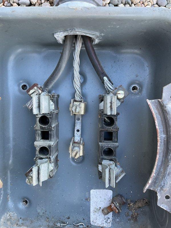 Responded to warranty callback for power issues following initial electrical installation. Upon inspection, identified faulty neutral connection at the meter base, with evidence of corrosion and oxidation on service entrance conductors and terminal connections. Documented existing conditions showing deteriorated grounding connections and weathered exterior service equipment requiring immediate attention to restore proper electrical service and ensure system safety.