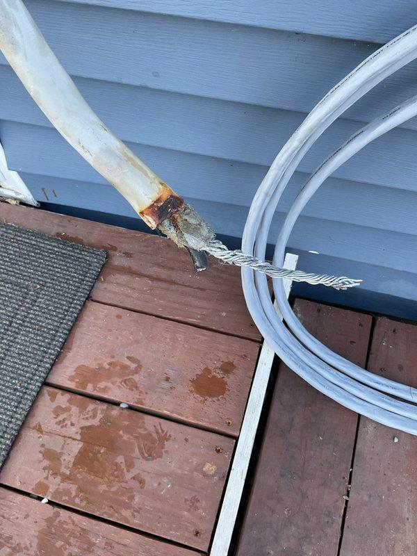 Responded to warranty callback for power issues following initial electrical installation. Upon inspection, identified faulty neutral connection at the meter base, with evidence of corrosion and oxidation on service entrance conductors and terminal connections. Documented existing conditions showing deteriorated grounding connections and weathered exterior service equipment requiring immediate attention to restore proper electrical service and ensure system safety.