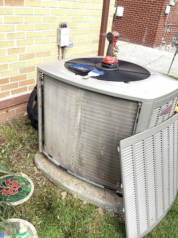 Completed annual cooling maintenance on outdoor condensing unit. Performed comprehensive system inspection, checked refrigerant pressures and temperatures using manifold gauges, cleaned condenser coils which showed moderate debris accumulation and discoloration, and verified proper fan operation. Noted minor surface rust at unit base but unit operating within normal parameters.