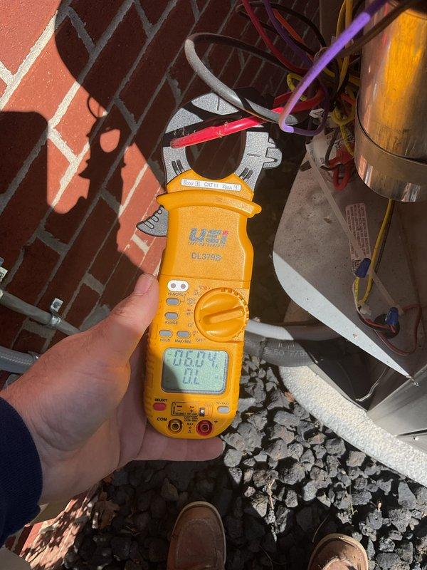 Performed complimentary preventative maintenance visit on residential cooling system. Conducted electrical diagnostics using digital clamp meter on outdoor condensing unit, verifying power factor readings and electrical performance. Inspected indoor air handler unit, checking electrical connections and control wiring integrity. All components operating within normal parameters at time of service.