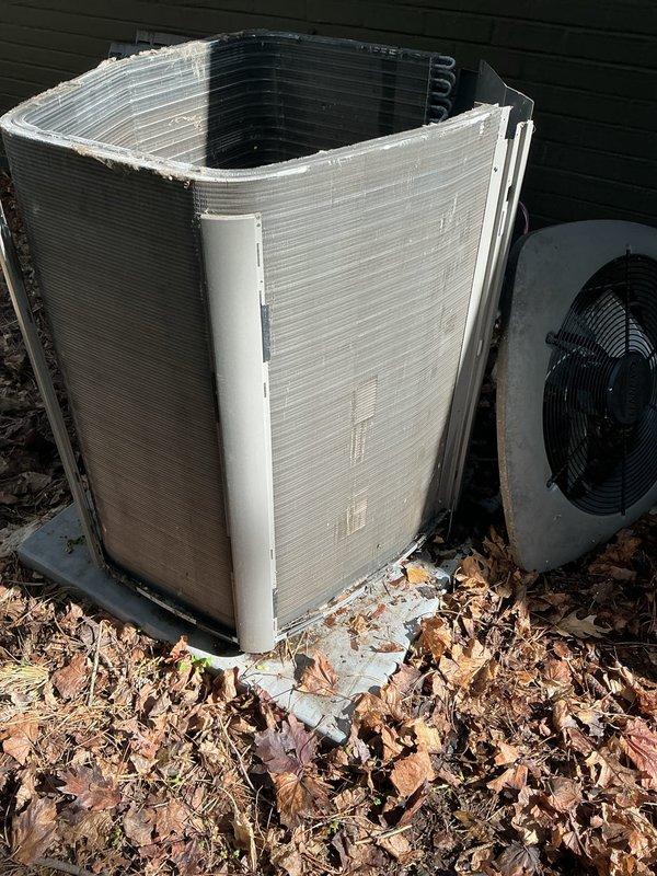 Performed annual maintenance on outdoor air conditioning condenser unit. Removed protective casing to access internal components and discovered heavy accumulation of leaves, twigs, pine needles, and organic debris throughout the unit, including substantial buildup on compressor housing and surrounding areas. Thoroughly cleaned all debris from condenser coils, compressor assembly, and interior compartment to restore proper airflow and prevent potential performance issues. Inspected electrical connections and verified unit integrity before reassembly.