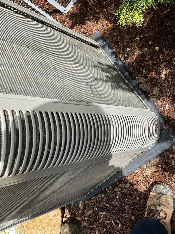 Completed annual preventive maintenance on residential RZ cooling system. Inspected outdoor condensing unit, verified proper airflow through coil fins and intake louvers, confirmed unit operational status, and documented equipment condition with photos. No filter replacement required during this service visit.