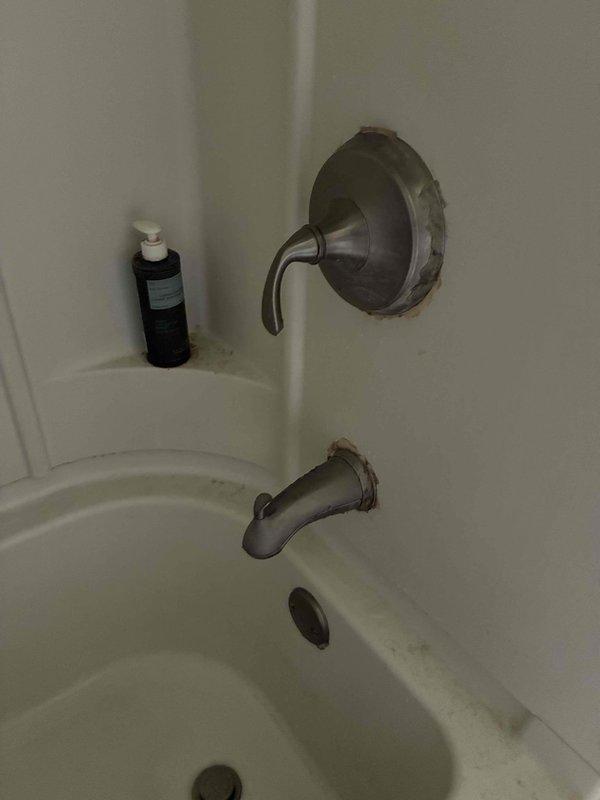 Responded to no hot water complaint at shower fixture. Upon inspection, identified isolation issue preventing hot water flow to shower valve while other fixtures maintained proper hot water supply. Inspected shower mixing valve with brushed nickel trim and lever handle, noting wall discoloration around escutcheon indicating potential long-term moisture exposure. Diagnosed faulty shower cartridge preventing hot water delivery to showerhead while tub spout and other bathroom fixtures operated normally. Replaced defective valve cartridge, tested hot water flow, and verified proper temperature mixing at shower fixture.