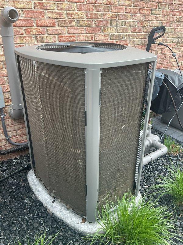 Completed annual cooling maintenance on two outdoor condensing units located against the building exterior. Performed comprehensive system inspection, replaced air filters and evaporative cooler pads on both units, and documented equipment condition with photographs. Both systems operational upon completion.