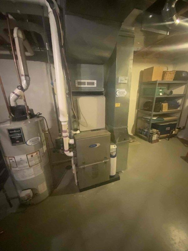 Provided estimate for replacement of a 26-year-old non-functional air conditioning system located in the basement. Assessed existing HVAC installation including Carrier furnace, electrical panel, and current AC unit configuration. Supplied product brochures and documentation for replacement equipment options.