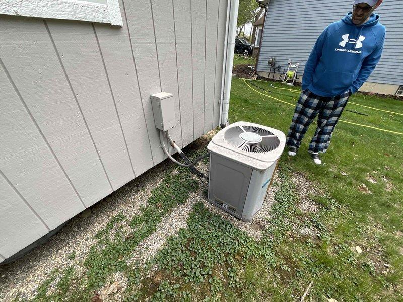 Completed estimate for air conditioning system replacement at residential property. Evaluated existing operational AC condenser unit located on gravel pad at rear exterior of home, along with indoor air handler/furnace system in basement mechanical room. Assessed current equipment condition, installation location, accessibility for replacement, electrical disconnect configuration, and ductwork connections to provide comprehensive replacement proposal for complete HVAC system upgrade.