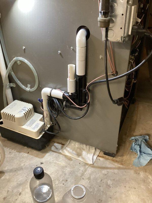 Completed annual cooling maintenance on residential air handler system. Inspected air handler unit, condensate pump, drainage lines, and associated PVC plumbing connections for proper operation and leaks. All components found operating within normal parameters with no immediate service needs identified.