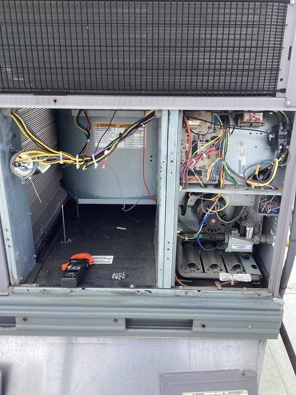 Performed comprehensive preventive maintenance on rooftop HVAC unit. Accessed internal compartments and inspected all major components including heat exchanger, evaporator coil, blower motor assembly, electrical connections, and control systems. Verified proper wire bundling and connections throughout electrical compartments, checked condensate drainage system components, and examined copper refrigerant lines for integrity. All warning labels and manufacturer specifications were confirmed visible and legible. Unit inspected for proper operation with all access panels secured upon completion.