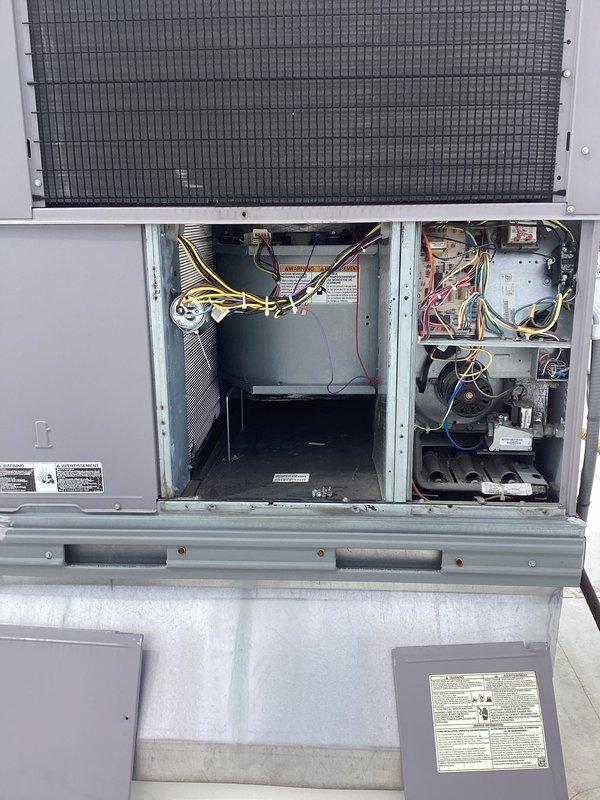 Performed comprehensive preventive maintenance on rooftop HVAC unit. Accessed internal compartments and inspected all major components including heat exchanger, evaporator coil, blower motor assembly, electrical connections, and control systems. Verified proper wire bundling and connections throughout electrical compartments, checked condensate drainage system components, and examined copper refrigerant lines for integrity. All warning labels and manufacturer specifications were confirmed visible and legible. Unit inspected for proper operation with all access panels secured upon completion.
