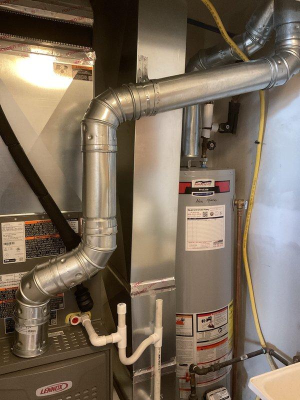 Completed full HVAC system installation including a Lennox 70,000 BTU furnace and 2-ton air conditioning unit with rear discharge configuration. Installed new furnace with gas valve assembly, draft inducer motor, and all necessary electrical connections and wiring. Fabricated and installed metal ductwork with proper joints and elbows to route airflow throughout the system. Connected flexible gas line to furnace, verified all mechanical and electrical components operational, and ensured proper venting and combustion air supply. System tested and confirmed operational upon completion.