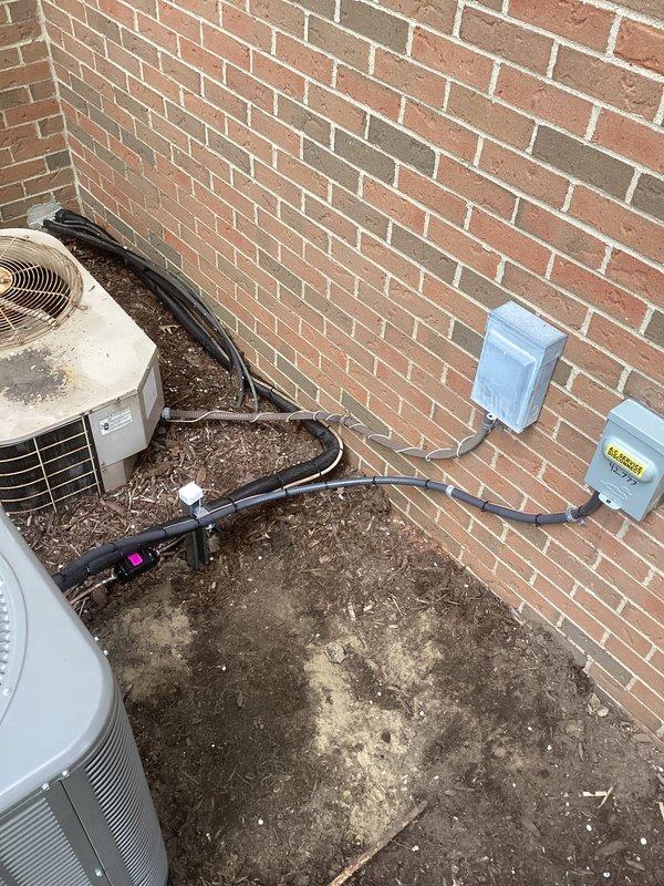 Completed full HVAC system installation including a Lennox 70,000 BTU furnace and 2-ton air conditioning unit. Installed furnace in interior utility room with proper ductwork connections, PVC condensate drainage, and ventilation; mounted outdoor AC condenser unit on exterior brick wall with electrical conduit and refrigerant line connections routed through wall penetrations. All equipment installed per manufacturer specifications with proper clearances, system tested and operational upon completion.