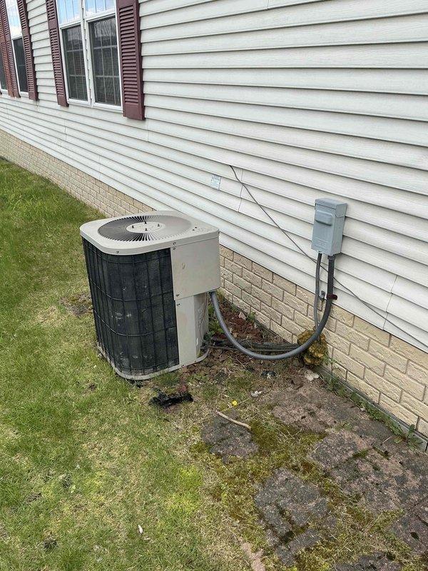 Conducted full system estimate for residential HVAC replacement following furnace failure. Evaluated existing 16-year-old heating and cooling equipment, including outdoor air conditioning unit with cylindrical condenser configuration and indoor furnace system accessed through louvered utility door. Documented current system condition, electrical disconnect location, refrigerant line routing, and concrete pad integrity showing age-related deterioration, and provided comprehensive replacement options for immediate system installation.