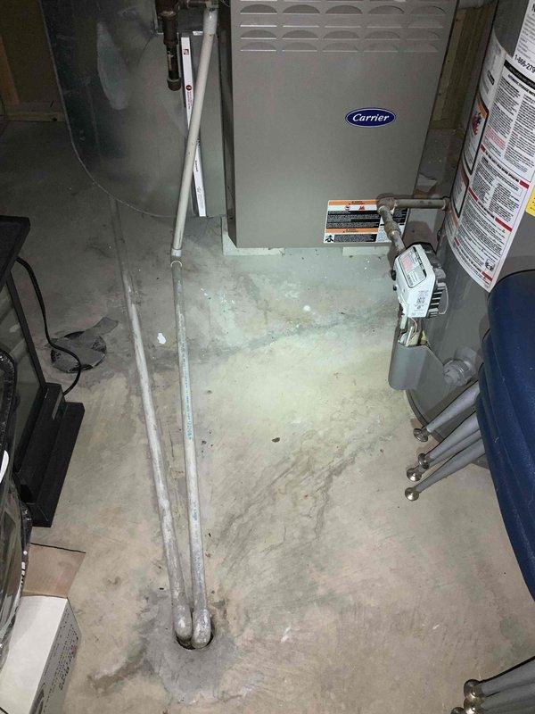 Provided estimate for replacement of existing Carrier furnace and air conditioning system located in basement utility area. Current furnace operational but aging air conditioning unit experiencing performance issues. Assessed existing HVAC infrastructure including ductwork, condensate drainage system, and associated mechanical components to determine replacement requirements and compatibility with new equipment installation.