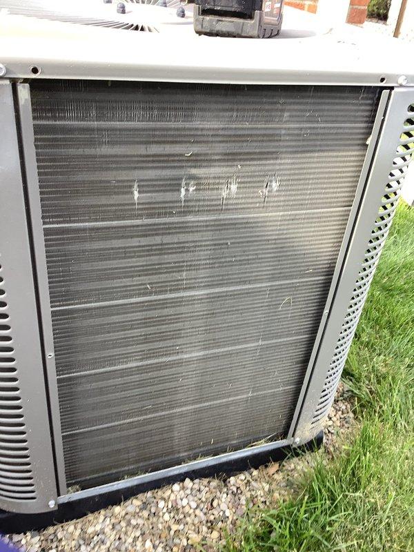 Responded to service call for outdoor AC unit with damaged wire from lawn maintenance activity. Upon inspection, located severed low-voltage wire near unit base where electrical conduit runs along foundation. Repaired damaged conductor, verified proper wire gauge and connections, and restored wiring integrity. Inspected condenser coil and noted accumulated debris and minor fin damage requiring future cleaning and maintenance. Unit currently offline due to seasonal conditions; recommended functional testing when cooling season resumes to confirm proper operation of all electrical components and system performance.