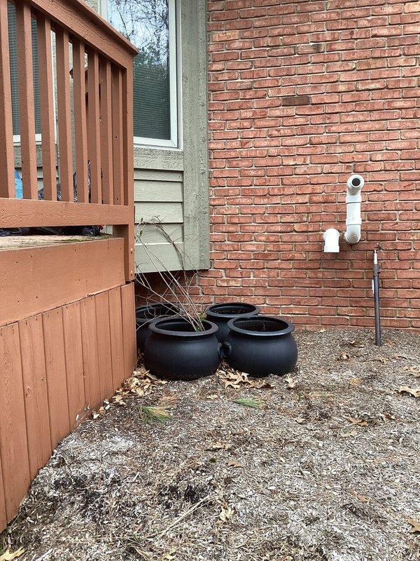 Responded to service call for outdoor condenser unit reported to be leaning. Upon arrival, inspected 2019 air conditioning system positioned against brick wall exterior. Confirmed unit was not level and assessed surrounding ground conditions, noting settled earth and debris accumulation around base. Documented equipment condition with photographs showing condenser placement, ground settlement, and proximity to building structure. Unit remains under parts warranty. Provided customer with findings and recommendations for proper leveling to prevent refrigerant line stress and potential compressor damage.