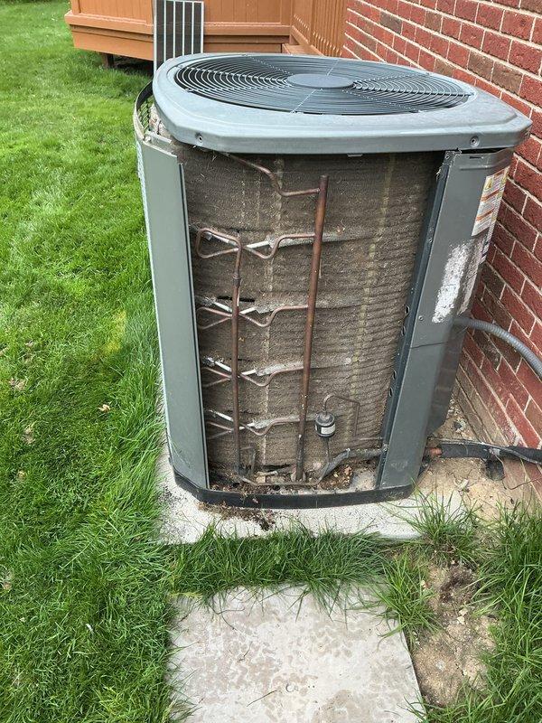 Completed annual cooling maintenance on outdoor condensing unit. Removed access panels and inspected internal components, finding accumulated dirt and debris on condenser coils. Cleaned coils and internal framework to restore proper airflow and heat transfer efficiency. Connected refrigerant manifold gauges to service ports and performed system diagnostics, recording operating pressures and temperatures to verify proper refrigerant charge and system performance. All readings confirmed unit operating within manufacturer specifications upon completion of maintenance procedures.