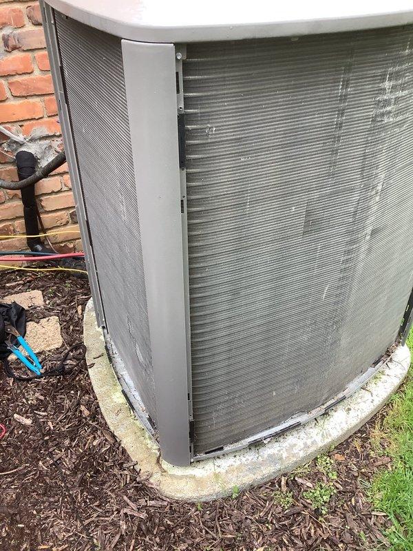 Completed annual cooling maintenance on outdoor condenser unit. Performed standard ACM protocol including inspection of condenser coils, which showed significant dirt and debris accumulation with visible streaking and discoloration across heat exchanger fins. Unit operational at time of service with all components functioning within normal parameters.