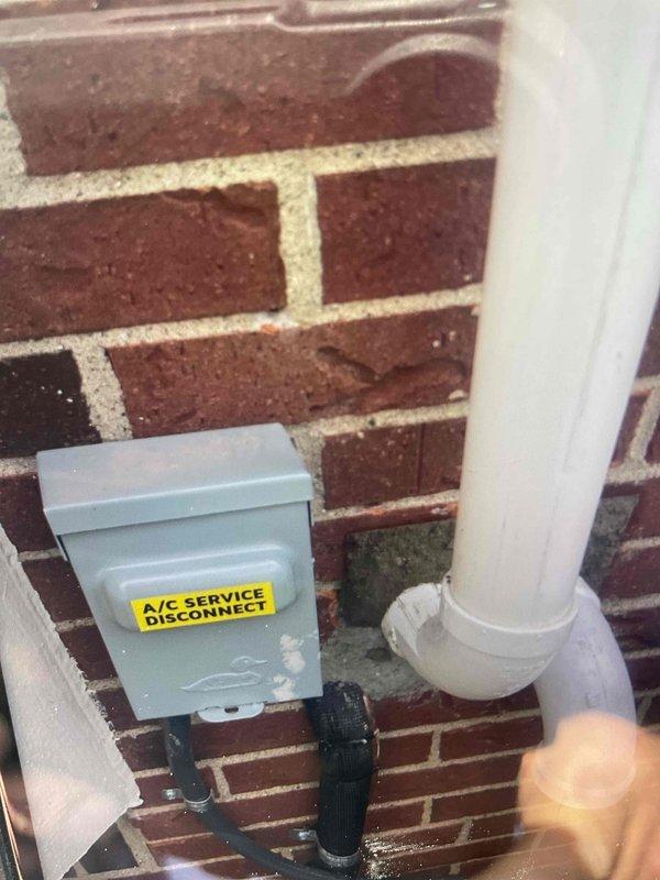 Responded to callback regarding oil residue on brick paver patio from previous condenser removal. Procured cleaning supplies and successfully removed oil stains from pavers. Verified proper installation of 70,000 BTU furnace, 2.5-ton rear-discharge air conditioning system, humidifier, and all reconnections. Confirmed A/C service disconnect box and condensate drain line properly mounted to exterior brick wall per code requirements.