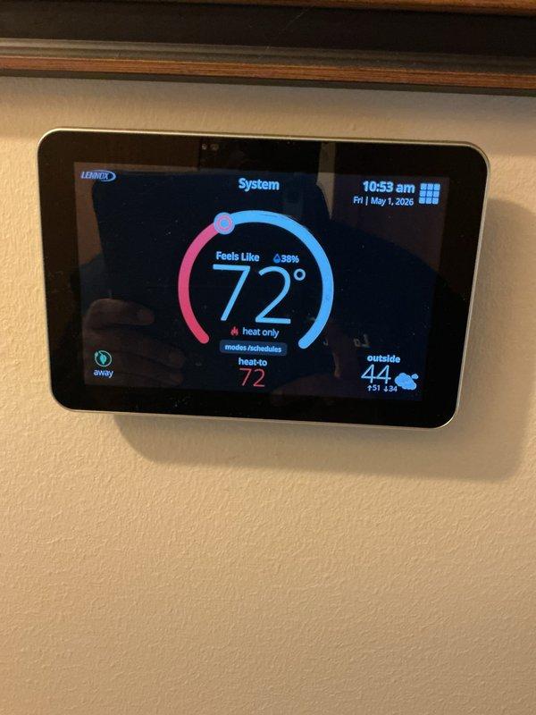 Completed annual cooling maintenance on Lennox HVAC system. Verified thermostat operation and programming, confirmed system status showing heat mode set to 72° with outdoor temperature at 44°. Inspected smart home hub integration and confirmed proper communication between thermostat and control panel, with all system components responding appropriately.