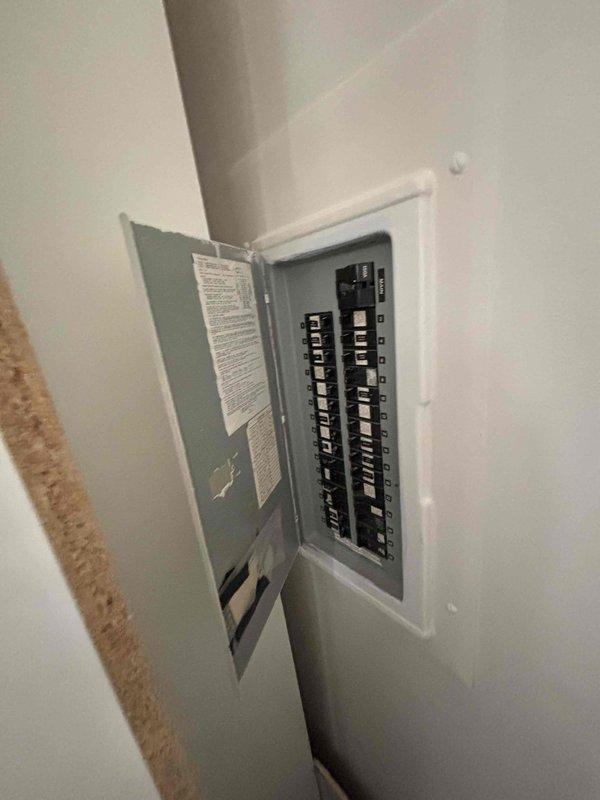Conducted comprehensive HVAC system evaluation for replacement estimate on 20-year-old natural gas furnace and air conditioning system located in basement. Existing equipment currently operational but nearing end of service life. Assessed electrical infrastructure and circuit breaker panel capacity to verify compatibility for new HVAC installation, documenting existing breaker configuration and identifying available 240V circuit from unused dryer breaker for equipment power requirements. Provided detailed replacement recommendations for complete furnace and air conditioning system upgrade with proper electrical specifications.