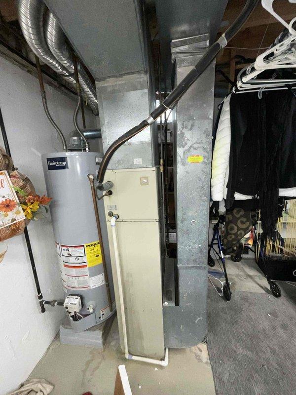 Provided comprehensive estimate for complete HVAC system replacement in basement location, including both furnace and air conditioning units. Existing 42-year-old equipment assessed as unsafe and non-operational, with air conditioning system currently inoperable and furnace displaying hazardous conditions including significant moisture accumulation on ductwork and metal components. Recommended immediate replacement of natural gas furnace and central air conditioning system due to age, safety concerns, and system failure.