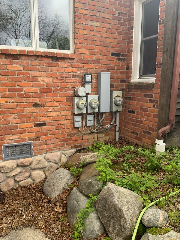 Conducted on-site evaluation for complete HVAC system replacement at residential property with 16-year-old equipment. Assessed non-operational air conditioning condenser unit located on exterior pad adjacent to brick foundation and 90% efficiency natural gas furnace in basement. Documented existing equipment configuration, electrical service connections, and installation requirements for proposed replacement system.