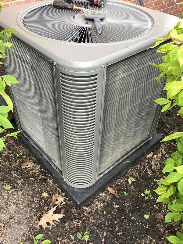 Completed annual cooling maintenance on residential air conditioning system. Performed filter replacement and changed thermostat batteries. Inspected outdoor condenser unit, which showed normal wear and weathering from outdoor exposure with visible dirt accumulation and organic growth on exterior surfaces. Unit operational and running as designed. All routine maintenance items addressed per scheduled service agreement.
