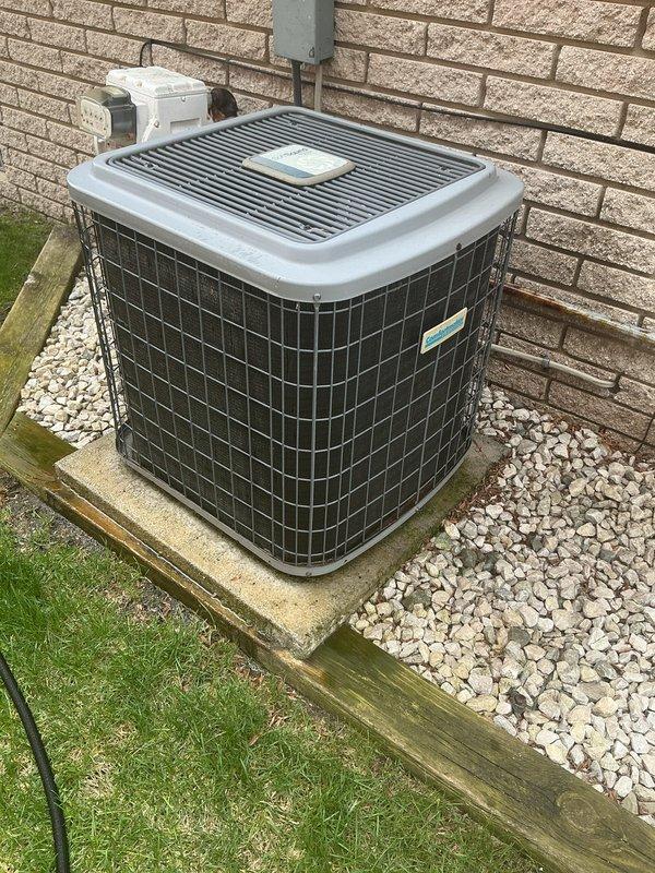 Completed comprehensive tune-up on 17-year-old residential furnace system and exterior condensing unit. Performed standard maintenance protocol including inspection of all mechanical components, electrical connections, and safety controls. Unit operational and positioned properly on concrete pad with adequate clearance from structure; outdoor condenser showing normal wear consistent with age and functional at time of service.
