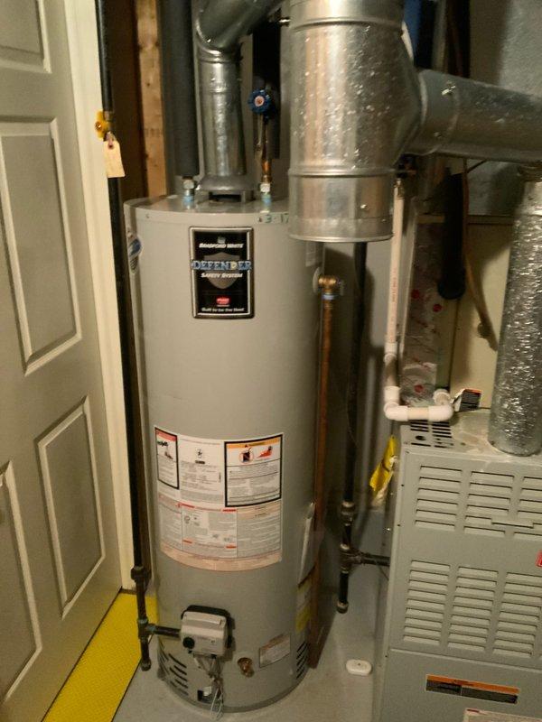 Conducted on-site evaluation of 25-year-old furnace system requiring replacement estimate. Documented existing HVAC equipment configuration, including utility room layout with water heater, ductwork connections, and electrical panel specifications. Photographed current system components and infrastructure to support comprehensive replacement proposal for aging heating equipment.