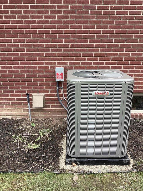 Completed full HVAC system installation including a 90,000 BTU furnace and 3.5-ton air conditioning unit. The furnace was installed in the basement utility area with proper PVC condensate drainage system, venting, and electrical connections, while the Lennox condenser unit was positioned on a pad against the exterior brick wall with refrigerant line set and disconnect box properly mounted. All mechanical and electrical permits were obtained, system was reconnected and tested for proper operation, and utility rebate documentation was processed.