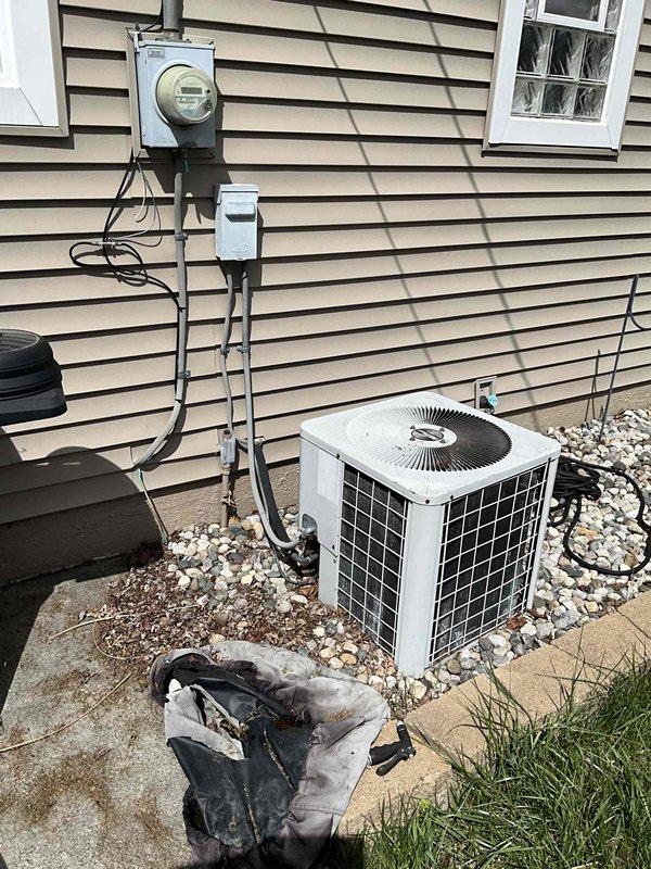 Conducted full system estimate for residential property with aging R22 air conditioning system and evaporator coil requiring replacement. Assessed existing outdoor condenser unit and indoor coil assembly, both at end of service life and utilizing obsolete R22 refrigerant. Customer requested estimate for new air conditioning system and evaporator coil while retaining existing furnace due to potential relocation within coming months. Documented current equipment configuration including outdoor unit placement on concrete pad with proper electrical disconnect and metering, and photographed existing HVAC installation for proposal development.