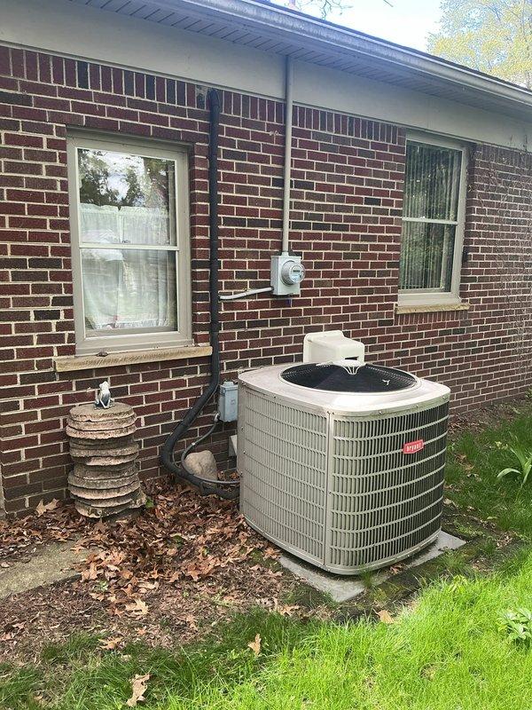 Responded to no-cooling call on 10-year-old outdoor condensing unit. Diagnosed communication failure between furnace, thermostat, and air conditioning system preventing compressor startup. Inspected Goodman R410A unit manufactured June 2009, verified electrical connections at outdoor unit, and troubleshot control wiring between indoor and outdoor equipment to restore proper system communication and cooling operation.