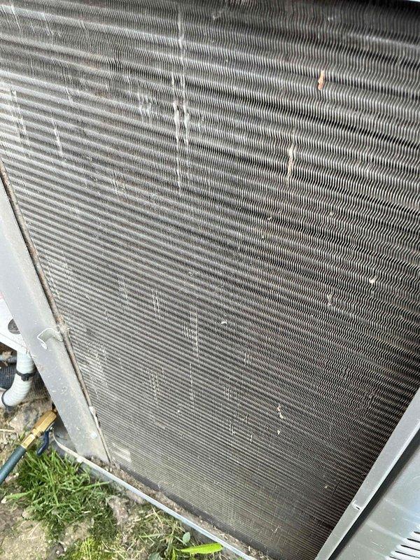 Completed annual HVAC maintenance inspection on outdoor condensing unit. Documented heavily soiled air filter with significant dust and debris accumulation, as well as condenser coil with dirt, organic matter, and oxidation buildup between fins. Unit operational with noted maintenance needs for filter replacement and coil cleaning to maintain optimal system efficiency.